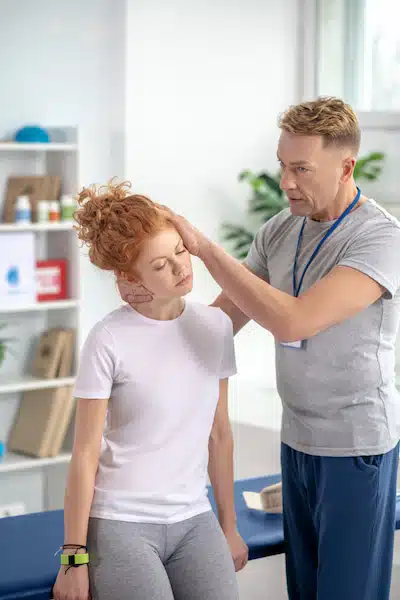 chiropractic adjustment performed on a woman for headache treatment