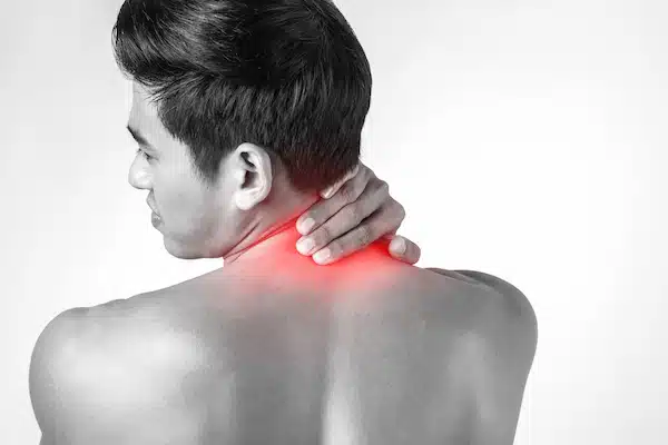 man experiencing neck pain from whiplash