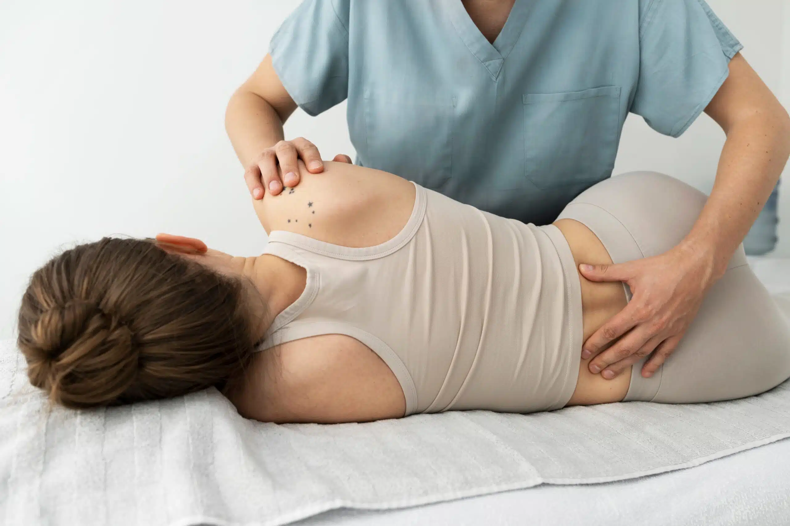 patient receiving chiropractic adjustments for herniated disk issues