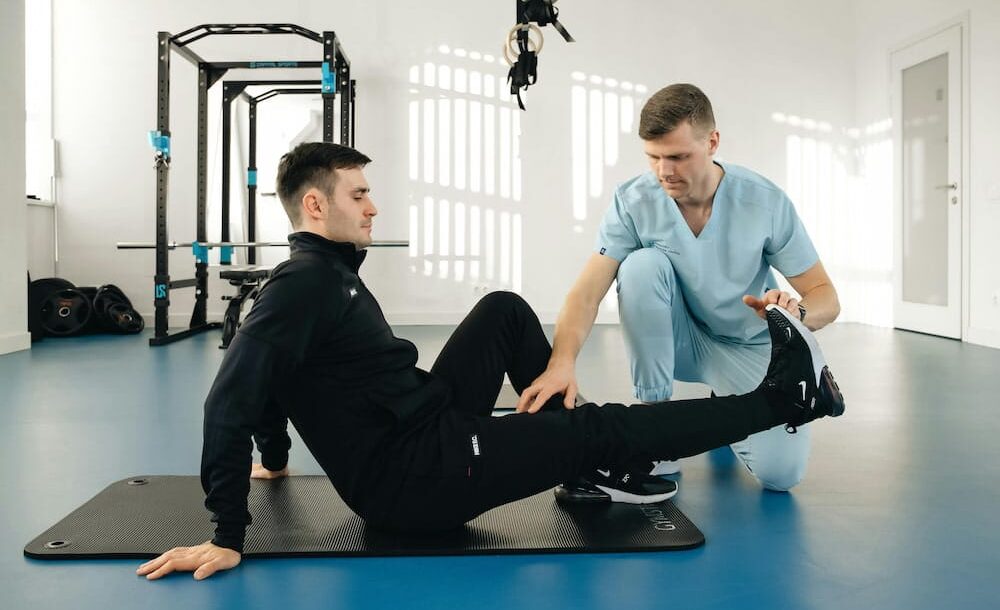 A chiropractor checks the shoulder of an old woman at Better Care Chiropractic and Physical Therapy in Montgomery and Willis